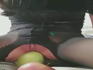 Pretty Girl Puts the Fruit into the Hole